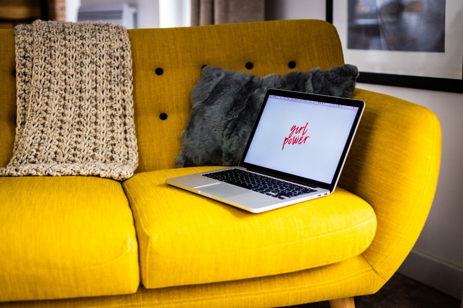 Laptop on a yellow couch